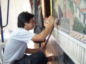 Restoring murals on the wall
