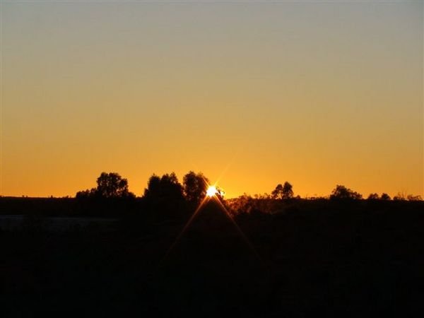 Sun rise at Ayres Rock campground