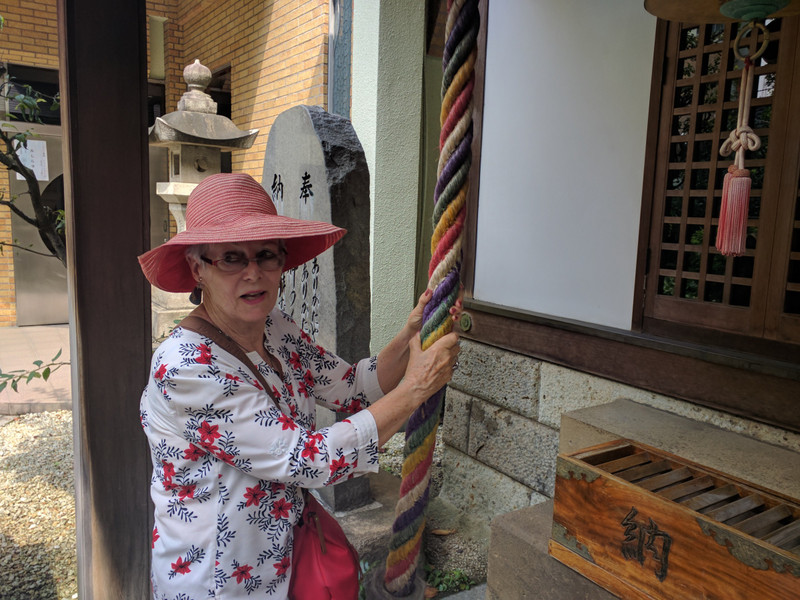 Michelle ringing the bell at the temple
