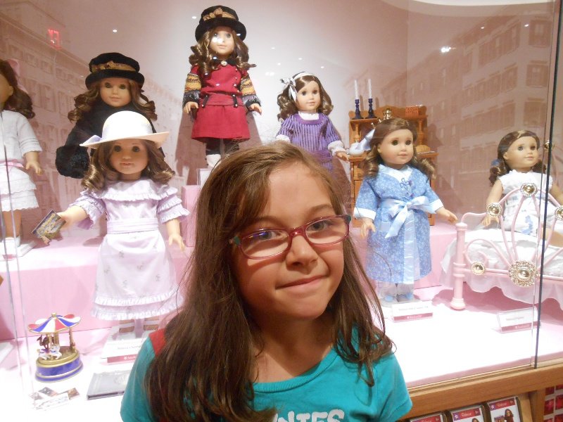 Grace and some of the many dolls in the American Doll store