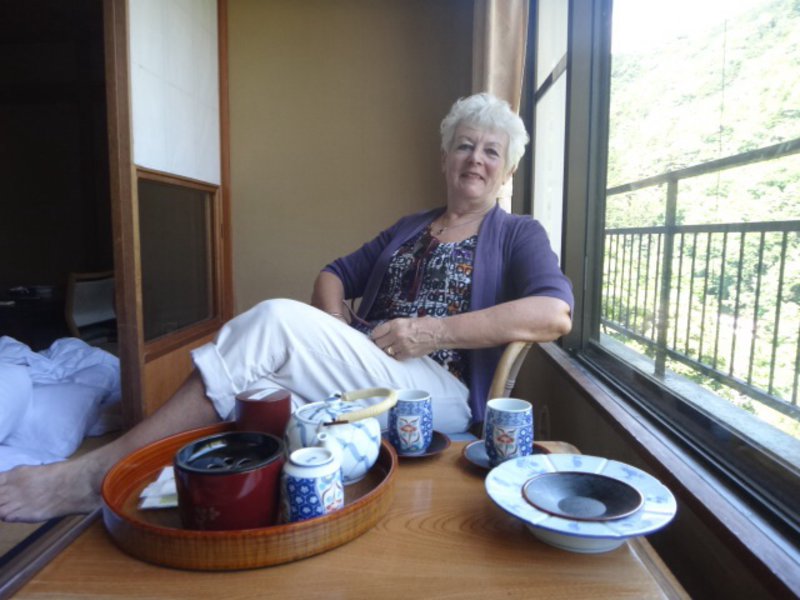 Michelle relaxing on the balcony with a pot of green tea