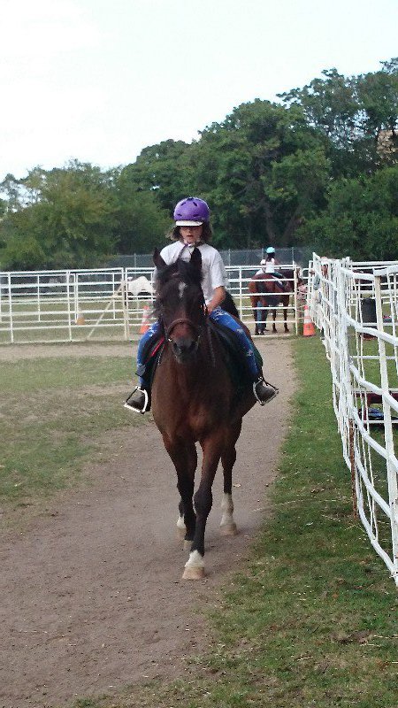 Grace at horse riding camp on Magic