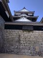 Part of the wall and Matsuyama Castle.