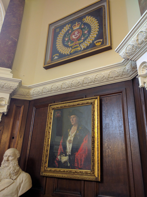 In the Lord Mayor's office with a portrait of the present Lord Mayor, Sharon Michael