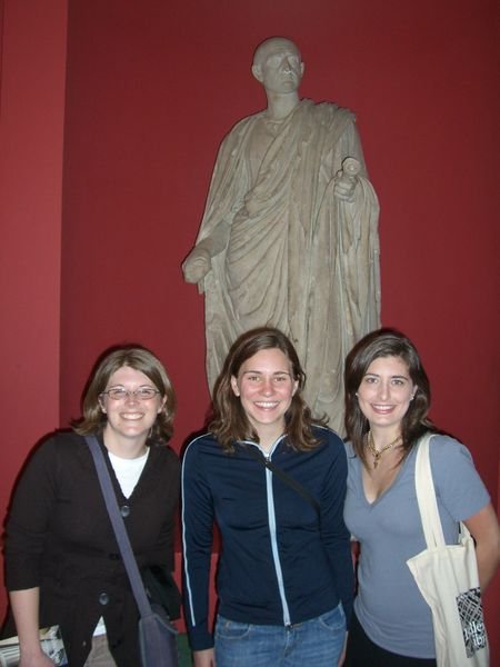 Heather, Jeanne, and Lauren in front of Cicero dressed as a scholar