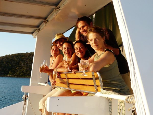 Watching sunset sitting on the catamaran, champagne in hand, Whitsunday Islands, Australia