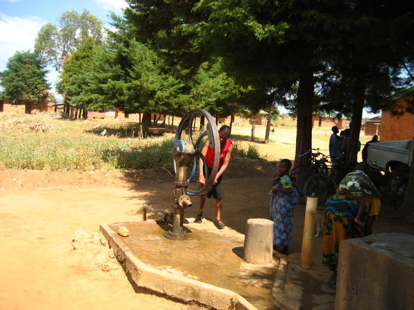 Hilda working a well outside one of the health ctrs