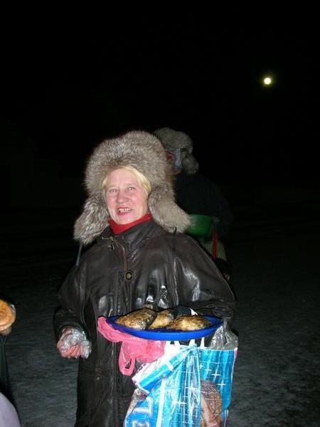 A friendly Russian Grandma selling fresh river fish