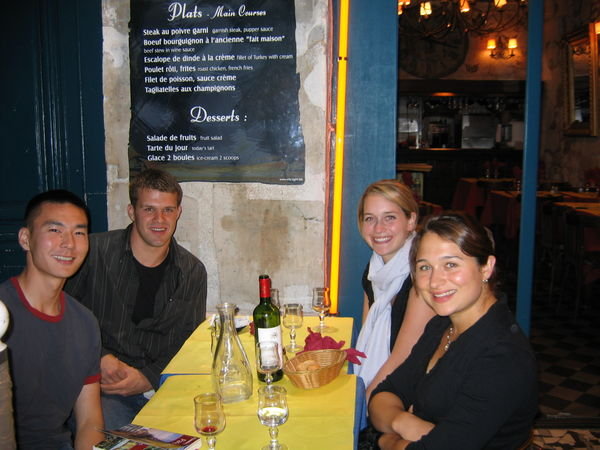 All 4 of us at dinner in Paris