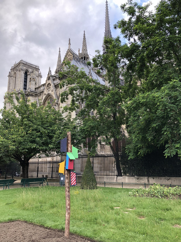 Sweet, colorful bird houses behind Notre Dame