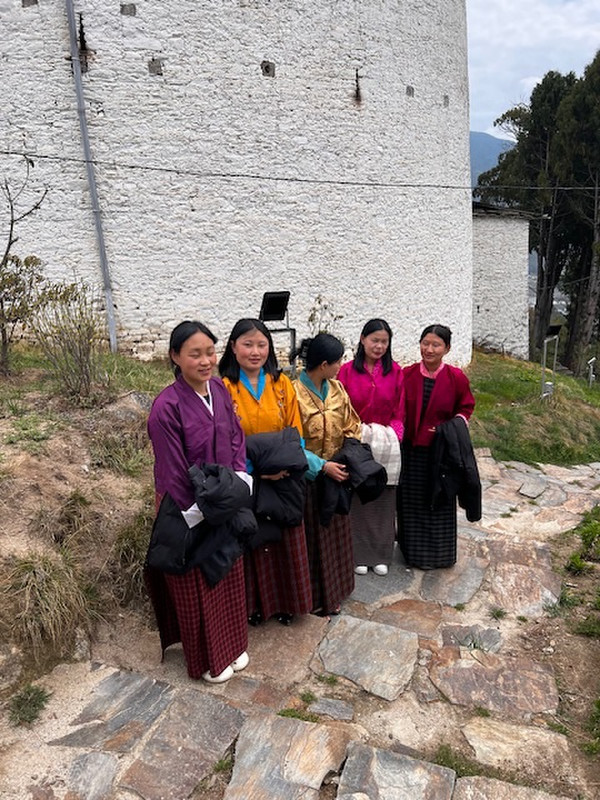 Young women in their national dress, the Kira