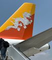 The flag of Bhutan on the tail of the plane. 