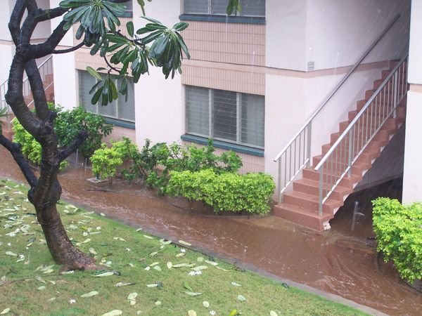 Flash flood water running through our condo due to the mountain run-off behind the complex