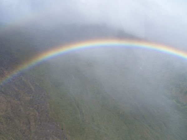 Part of a circular rainbow beneath our hovering copter