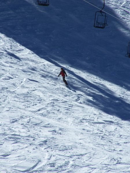 Snowboarder skimming the slopes