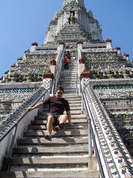 Navigating the steep stairs to the top of Wat Arun