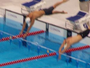 Michael Phelps diving in lane 4