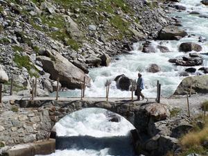 Crossing the bridge on the Trift Glacier trail