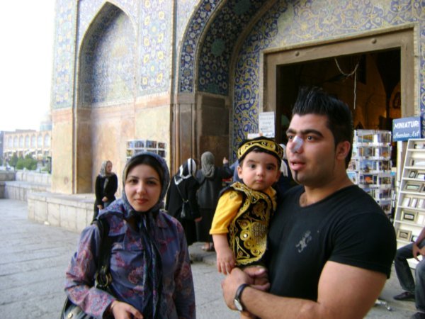 Family in front of entrance to Imam Mosque, Esfahan