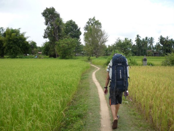 Mike with backpack and rice field