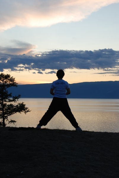 Lake Baikal at sunset - Thai Chi Woman