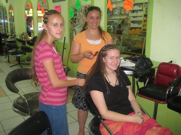 Taking our braids out at the pedicure place