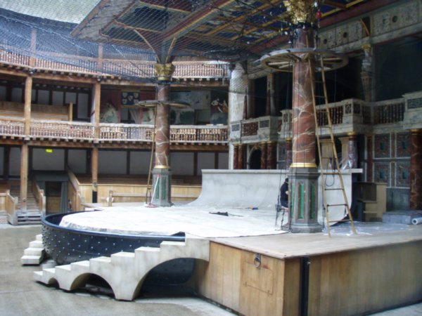 Inside the Globe.  The crew is fixing the set for Timon of Athens