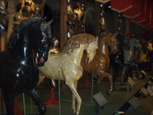 Imitation horses next to armour used by real kings