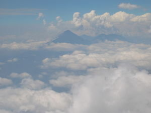 Volcan Acatenango appears above the clouds, view from volcan Acatenango