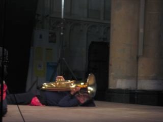 Chuck playing tuba on the ground