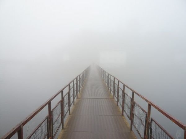 Iron footbridge out of Portomarin in the morning