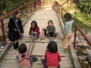 Hilltribe children playing a jumping game