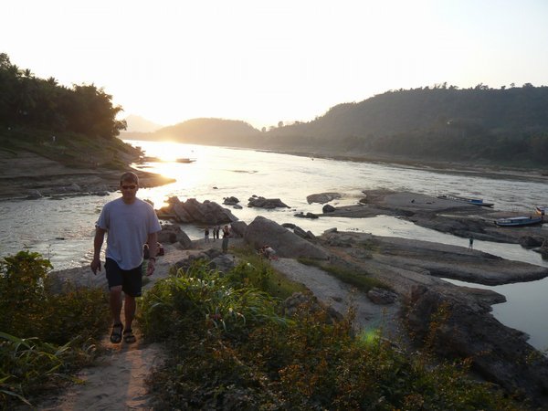 Dave walking up the shore where the the Nam Khan meets the Mekong River