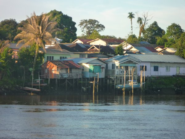 Houses on stilts along the river in Kuching