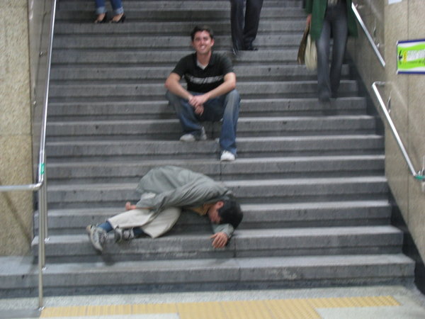 Man Passed Out On The Stairs Photo 