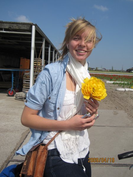 Liz is all smiles when the farmer gives her a tulip from his garden