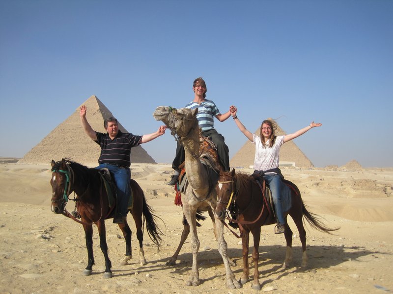 The family rejoicing on being at the pyramids