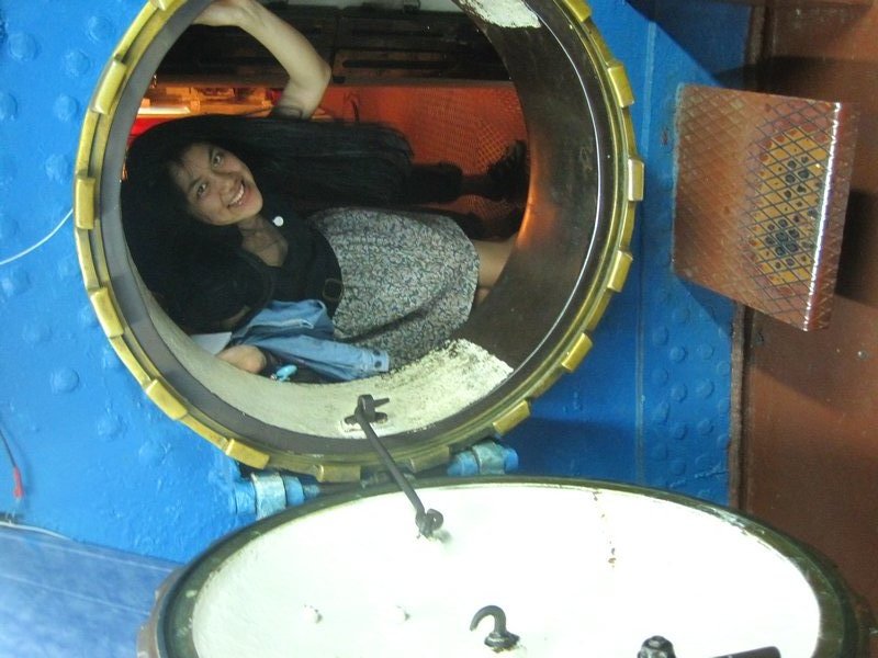 Ange peaking inside the submarine