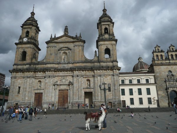 The main plaza of Bogota surrounded with the colonial cathedral and government buildings...and filled with families, couples, groups of friends, vendors, clowns, and ...