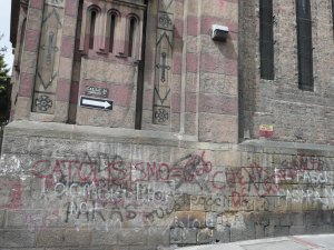 Political grafitti is EVERWHERE in dowtown Bogota...this one is on the side of a church and says "Catholicism=666 the cave of thieves"