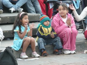 Little cuties all bundled up in the cold of Bogota and watching the clown show in the plaza!