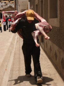 Turned around to almost be knocked over by this kid carrying a skinned Llama carcass on his shoulders down the street in the midday sun...was delivering it to a restaurant I think...ewwww