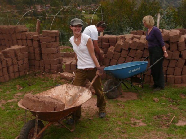 Some days the volunteers helped in the classroom...other days they helped with construction. Like hauling hundreds of mug bricks in wheel barrows! Those bricks are heavier than they look...especially in the noonday sun...especially after going out all nig