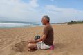 Markus meditating on the beach