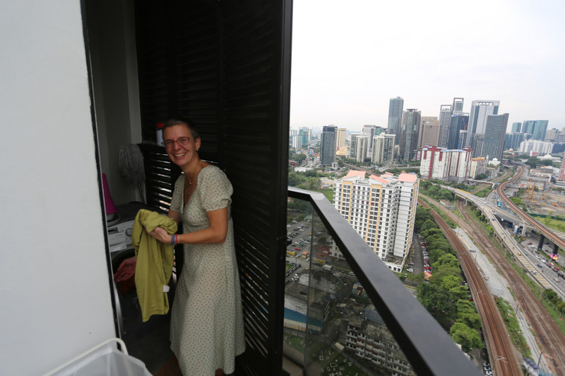 doing the washing on the balcony in the 21st floor with views over KL