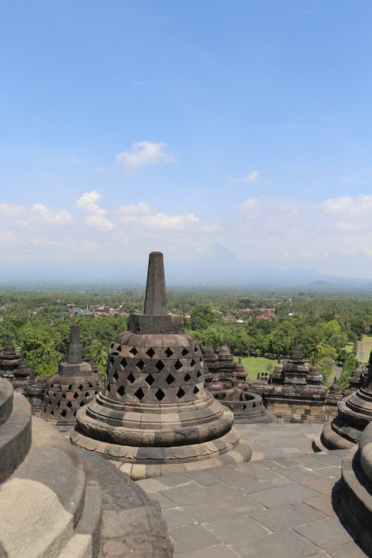 Borobudur and the vulcano Merapi in the background