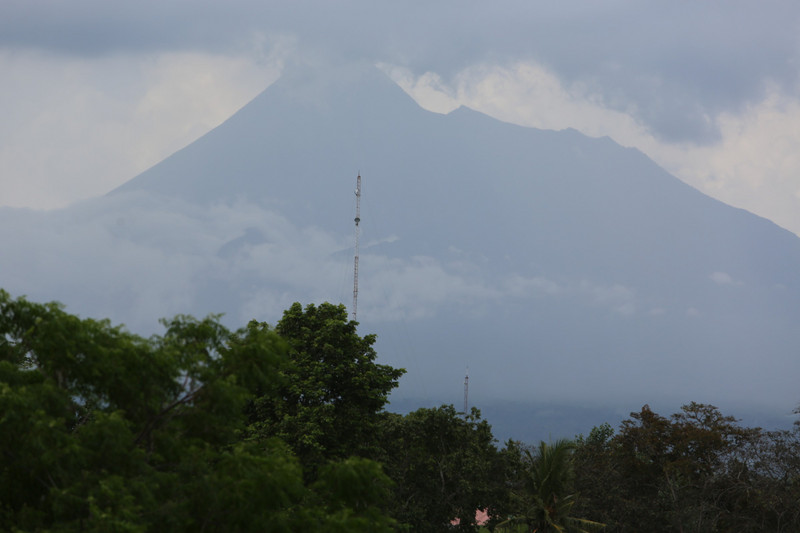 Mount Merapi seen from Prambanan just before thunderstorms arrived
