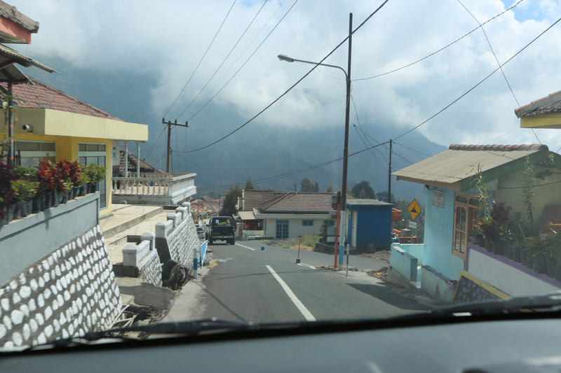 that main street of Cemoro Lawang is filled with hundreds of jeeps each single morning