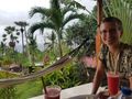 enjoying our welcome drink at the Frangipani Inn in Seraya