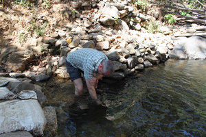 Markus washing away all his sins in the Papanasini River